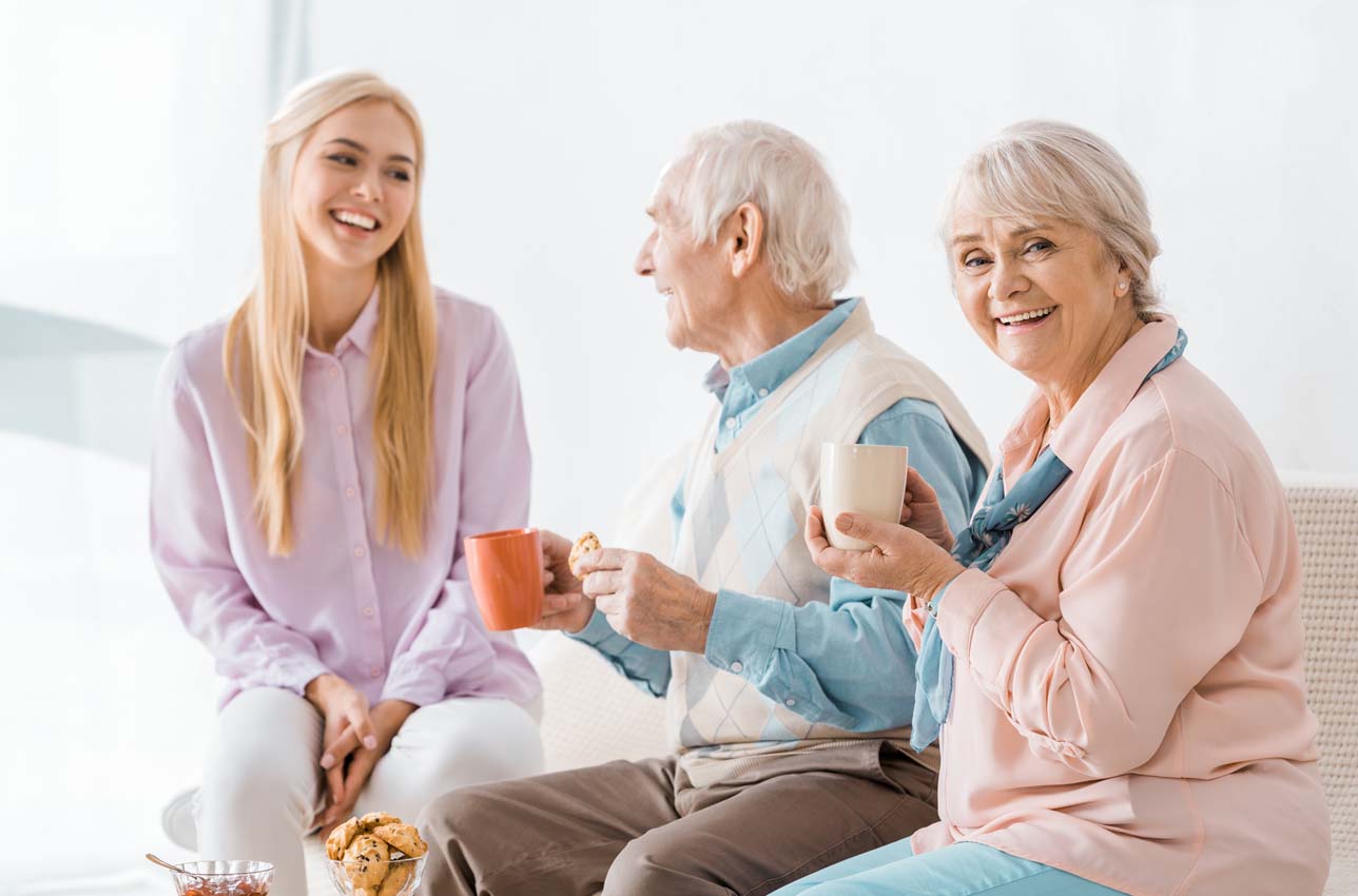 Smiling Family enjoying Snacks and Drinks at Home